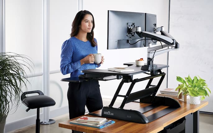 girl working at the office on a standing desk